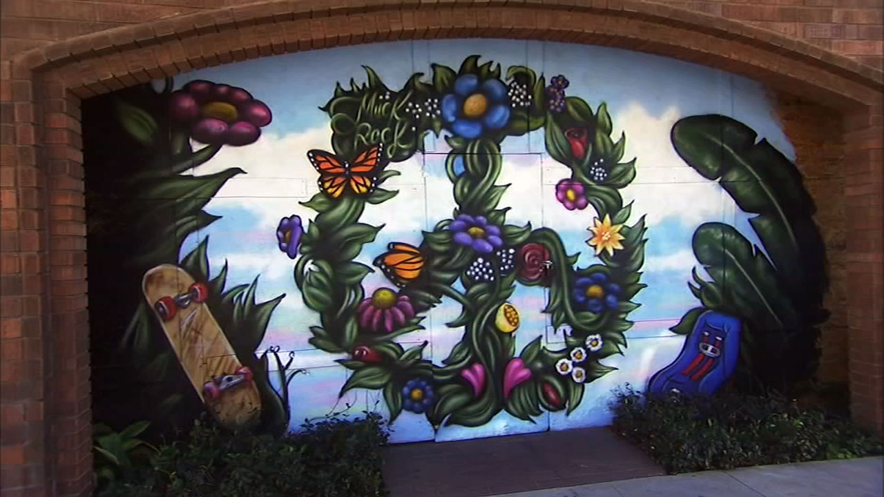Muralist gives back with peace-inspired Spark of Love t-shirt