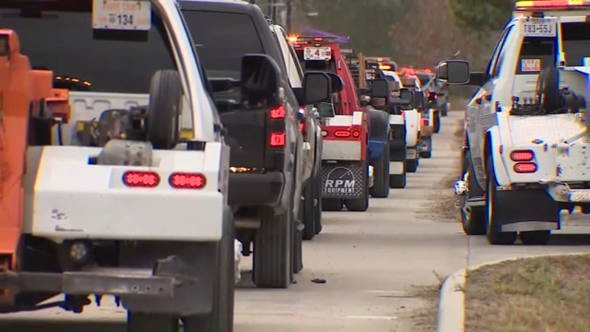 Tow truck procession honors 2 teen brothers killed