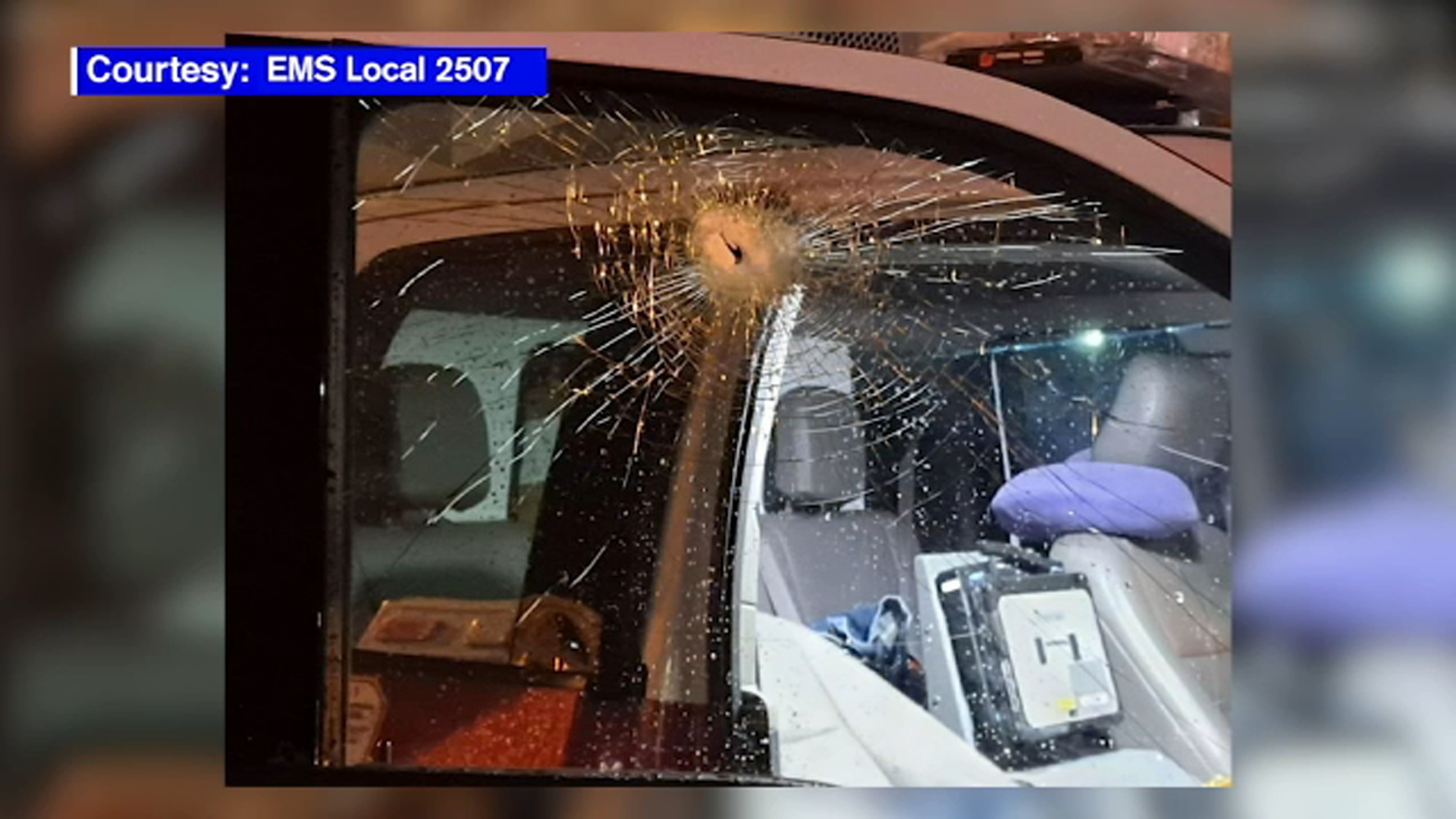 Ambulance window smashed, EMS crew unharmed