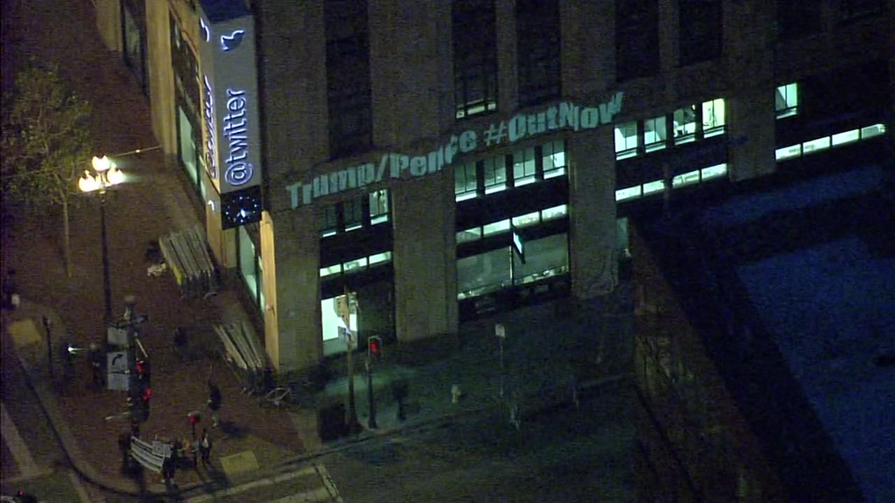 Anti-Trump messages projected on Twitter headquarters in SF