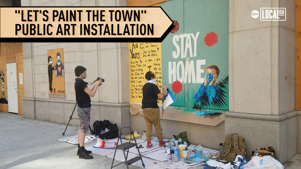 Boarded up storefront becomes canvas for street artists