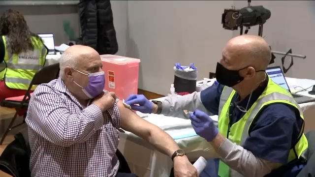 NYC podiatrist among volunteers helping with COVID vaccinations