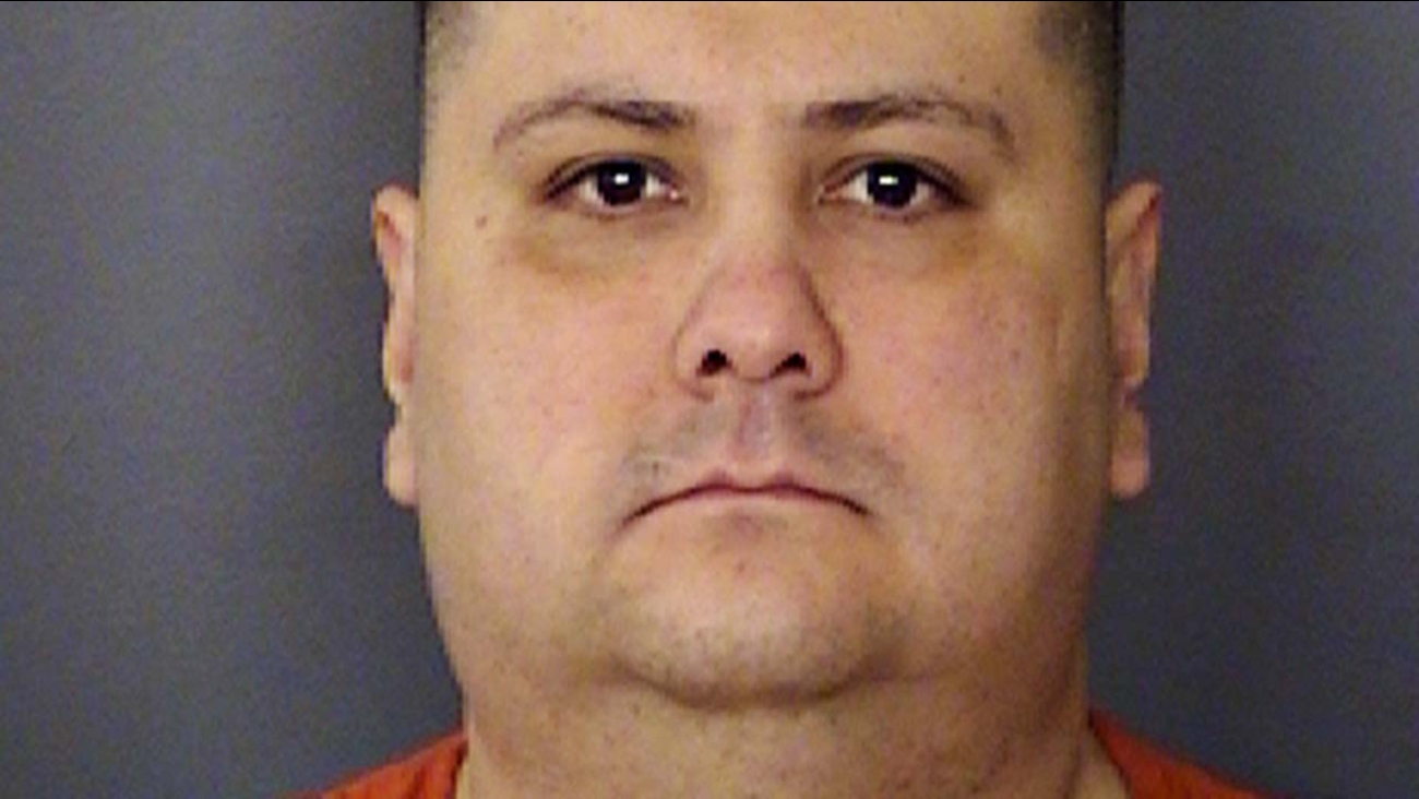 This undated handout photo provided by the Bexar County (Texas) Sheriff's Office, shows Gilbert Flores.